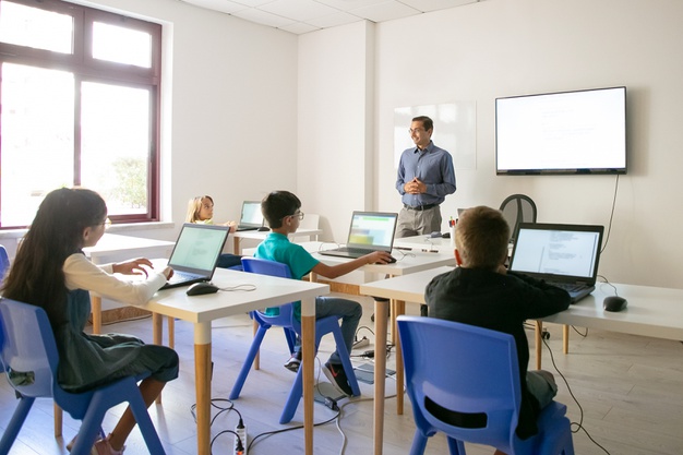 confident teacher explaining lesson pupils 74855 9751