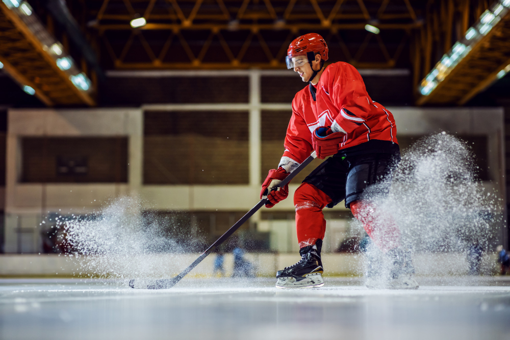 full length fearless hockey player skating trying make score hall interior winter sports